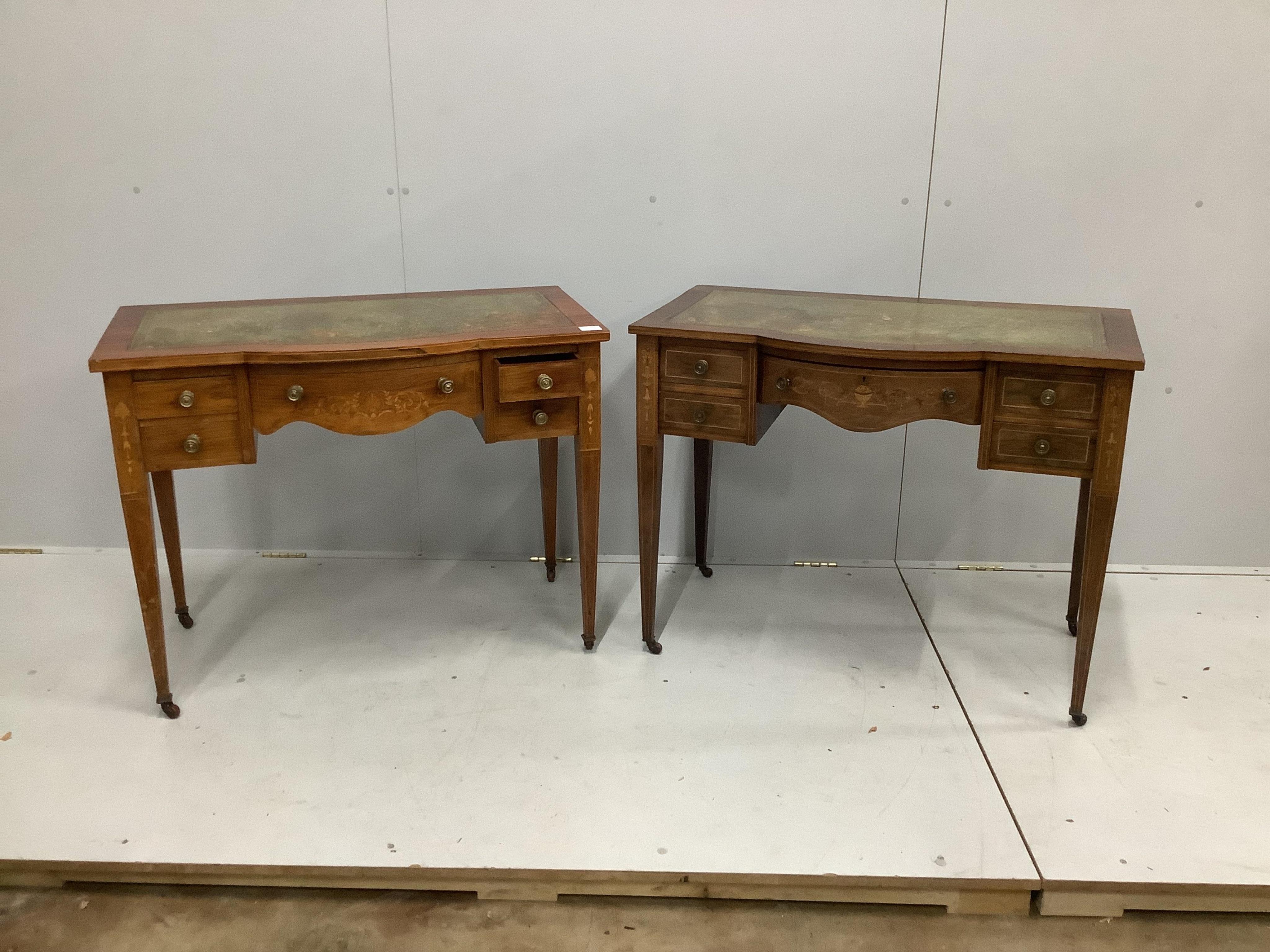 A near pair of Edwardian mahogany kneehole writing tables, larger width 91cm, depth 52cm, height 72cm. Condition - fair